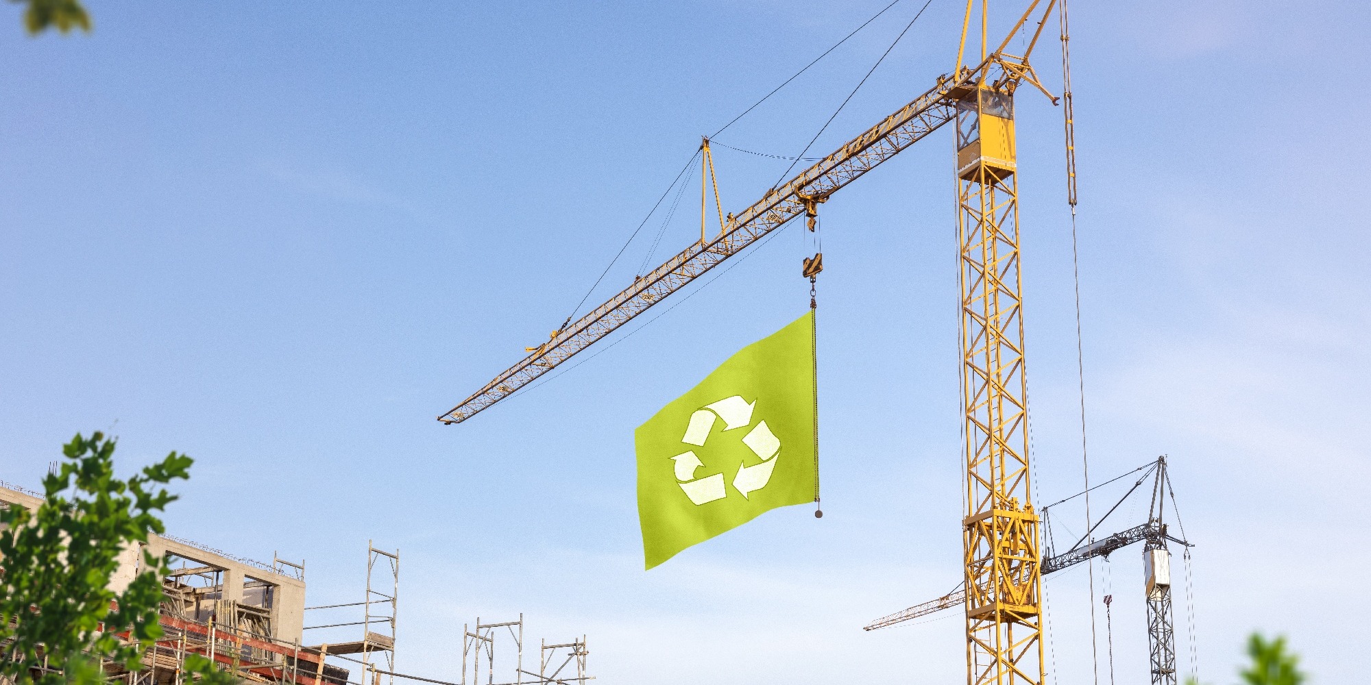 A crane with the "Recycle" emblem hanging from it