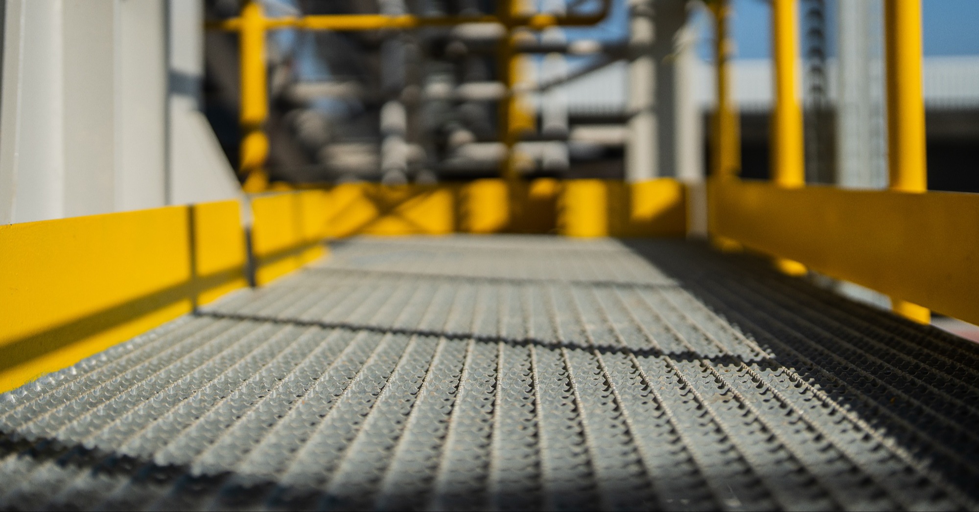 A closeup of an aluminum grated walkway